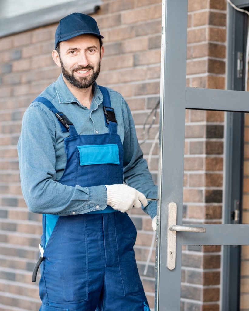 builder-installing-door-lock